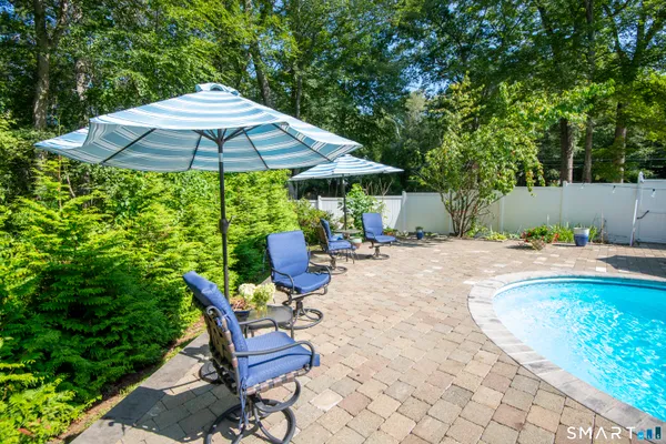 a view of a backyard with sitting area and furniture