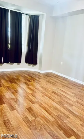 a view of wooden floor and closet