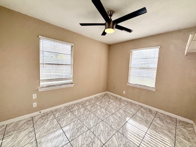 510 Roper Street Houston, TX 77034 - Photo 11 of 15 a bedroom with a large bed and a window
