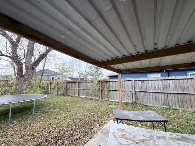 510 Roper Street Houston, TX 77034 - Photo 14 of 15 a backyard of a house with wooden floor and outdoor seating