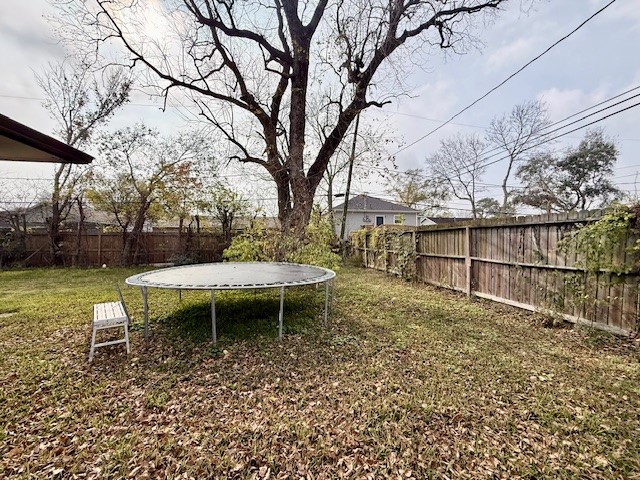 510 Roper Street Houston, TX 77034 - Photo 15 of 15 a backyard of a house with table and chairs