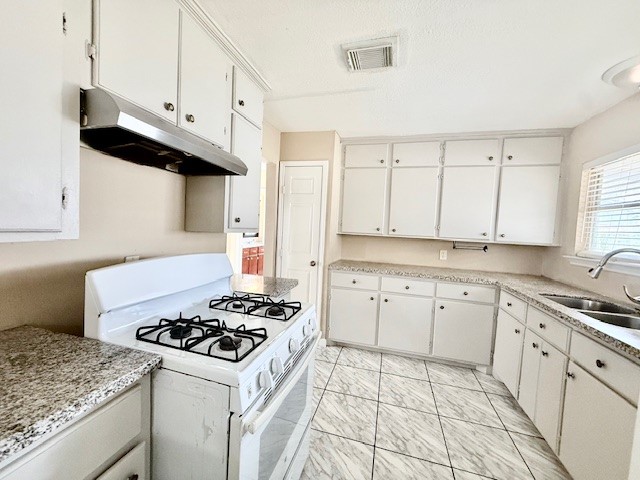 510 Roper Street Houston, TX 77034 - Photo 5 of 15 a kitchen with granite countertop cabinets and white appliances