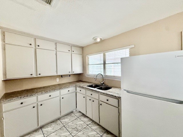 510 Roper Street Houston, TX 77034 - Photo 6 of 15 a kitchen with appliances cabinets and a window