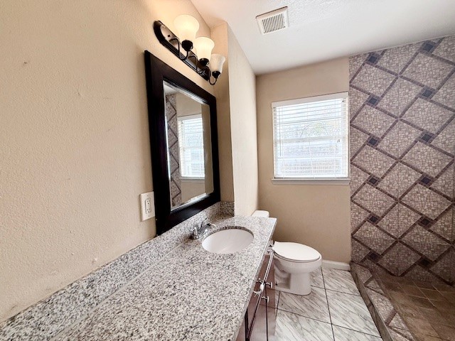 510 Roper Street Houston, TX 77034 - Photo 9 of 15 a bathroom with a granite countertop sink toilet and mirror