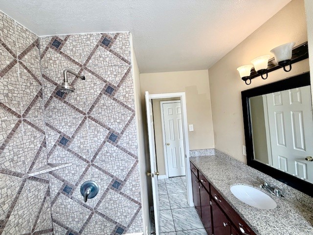 510 Roper Street Houston, TX 77034 - Photo 10 of 15 a bathroom with a granite countertop sink a mirror and shower