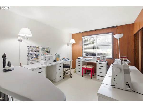 a living room with furniture a flat screen tv and a large window