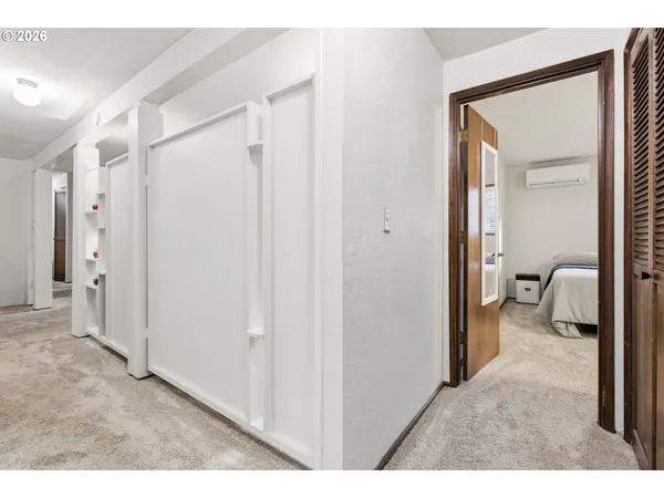 a bedroom with a bed and a cabinets