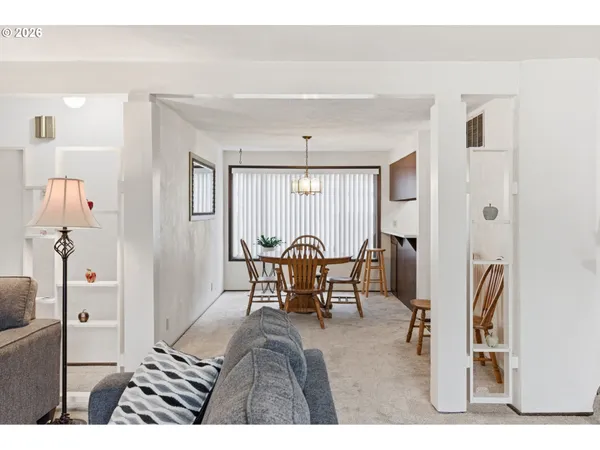 a balcony with table and chairs