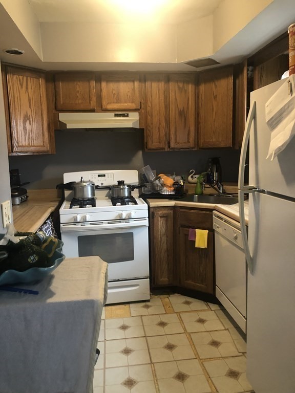 3 Havana Road Worcester, MA 01603 - Photo 3 of 21 a kitchen with a stove a sink and a refrigerator