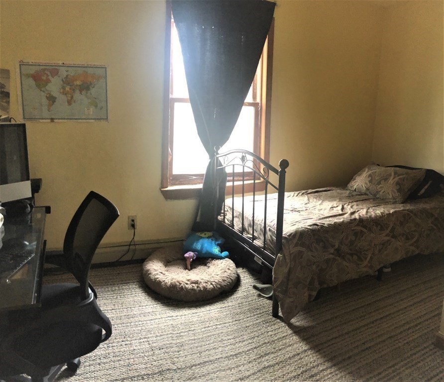 3 Havana Road Worcester, MA 01603 - Photo 9 of 21 a bed sitting in a bedroom next to a window