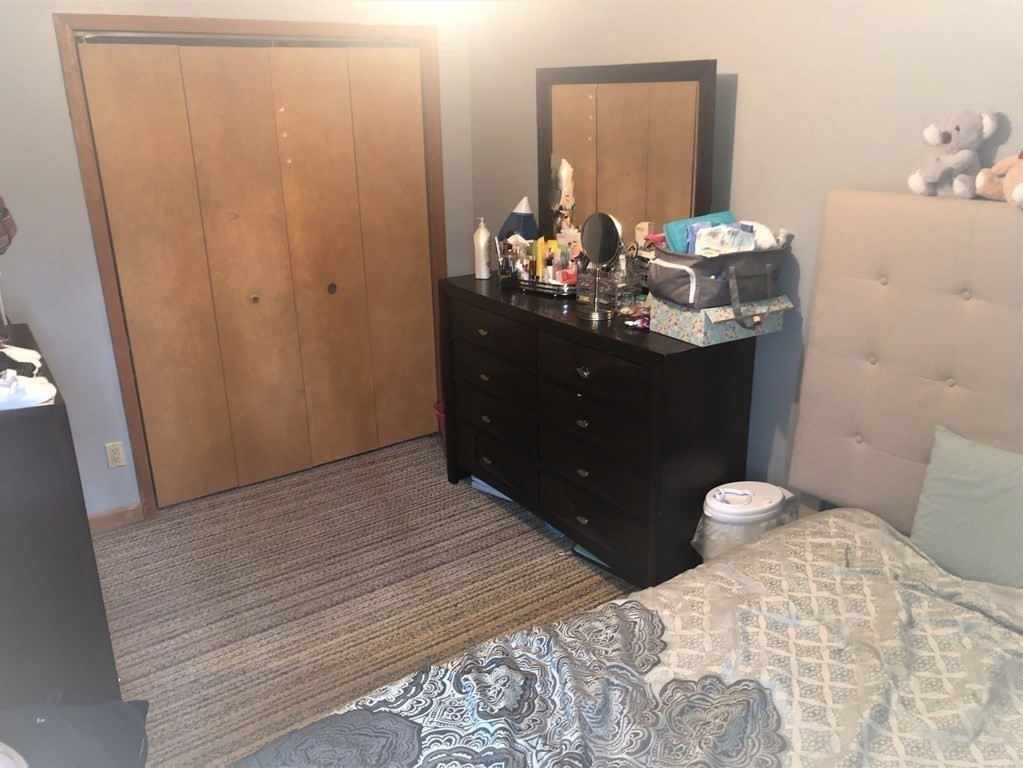3 Havana Road Worcester, MA 01603 - Photo 10 of 21 a bedroom with a bed and a mirror