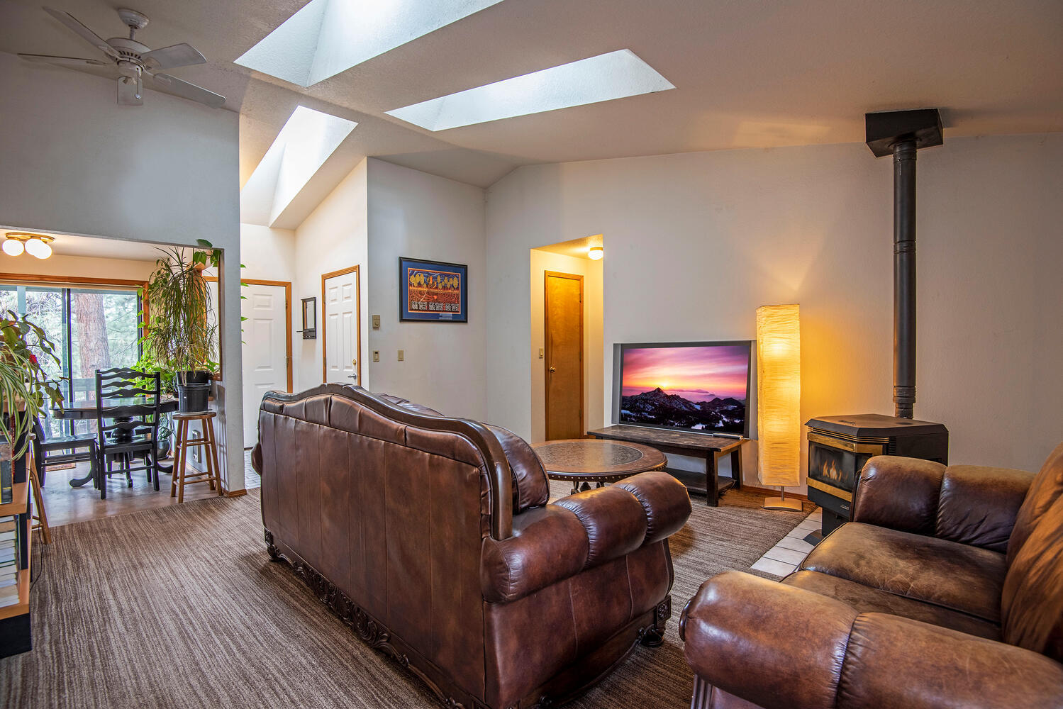1906 Southwest Forest Ridge Avenue Bend, OR 97702 - Photo 6 of 19 Living room with vaulted ceilings and skylights