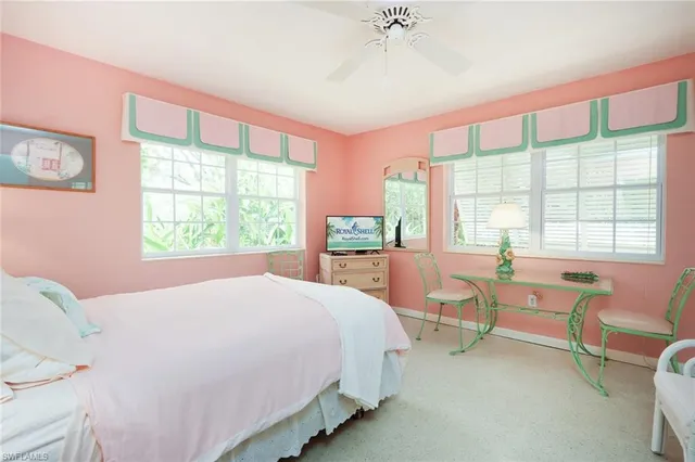 a bedroom with a bed and a view of chair