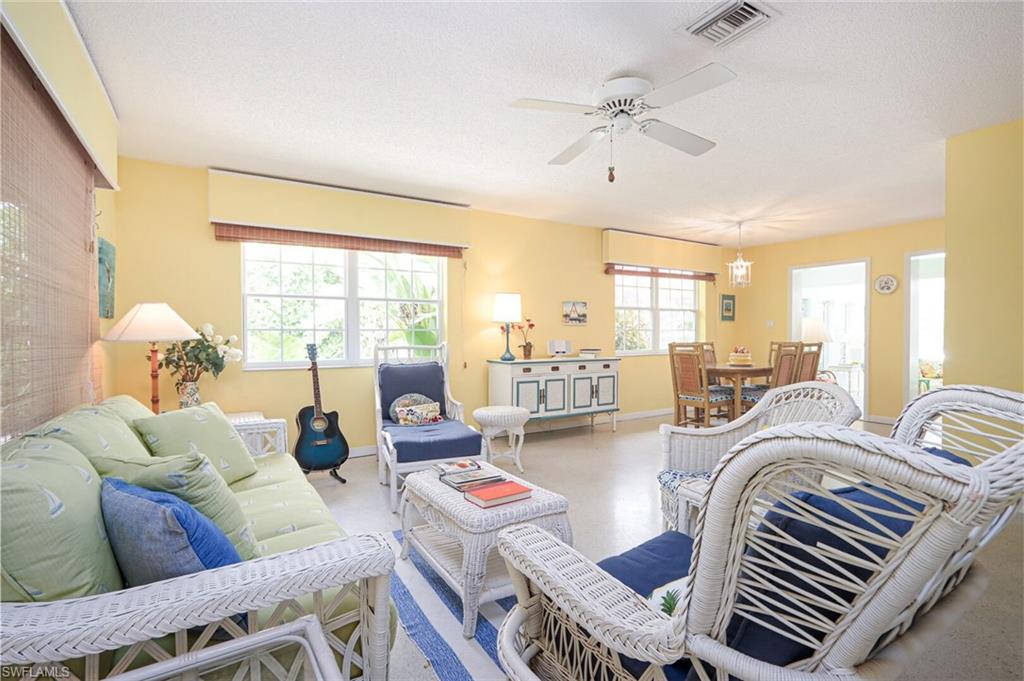 361 1st Avenue North Naples, FL 34102 - Photo 7 of 28 a living room with furniture and a large window