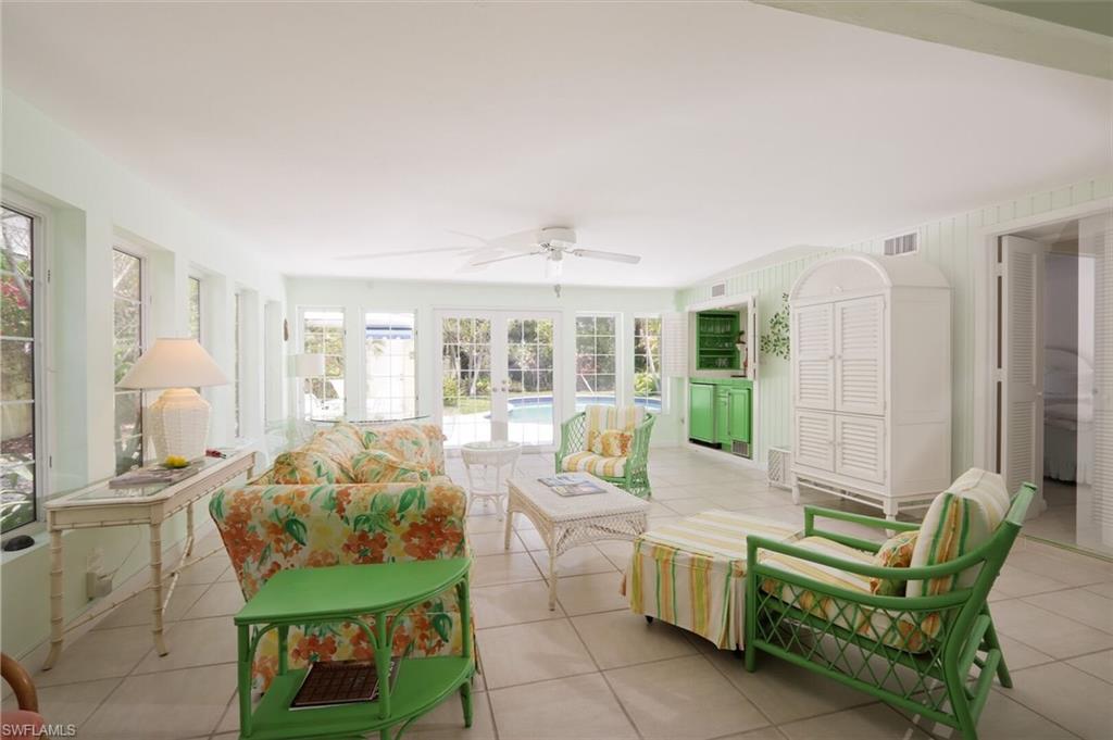 361 1st Avenue North Naples, FL 34102 - Photo 9 of 28 a living room with furniture and a large window