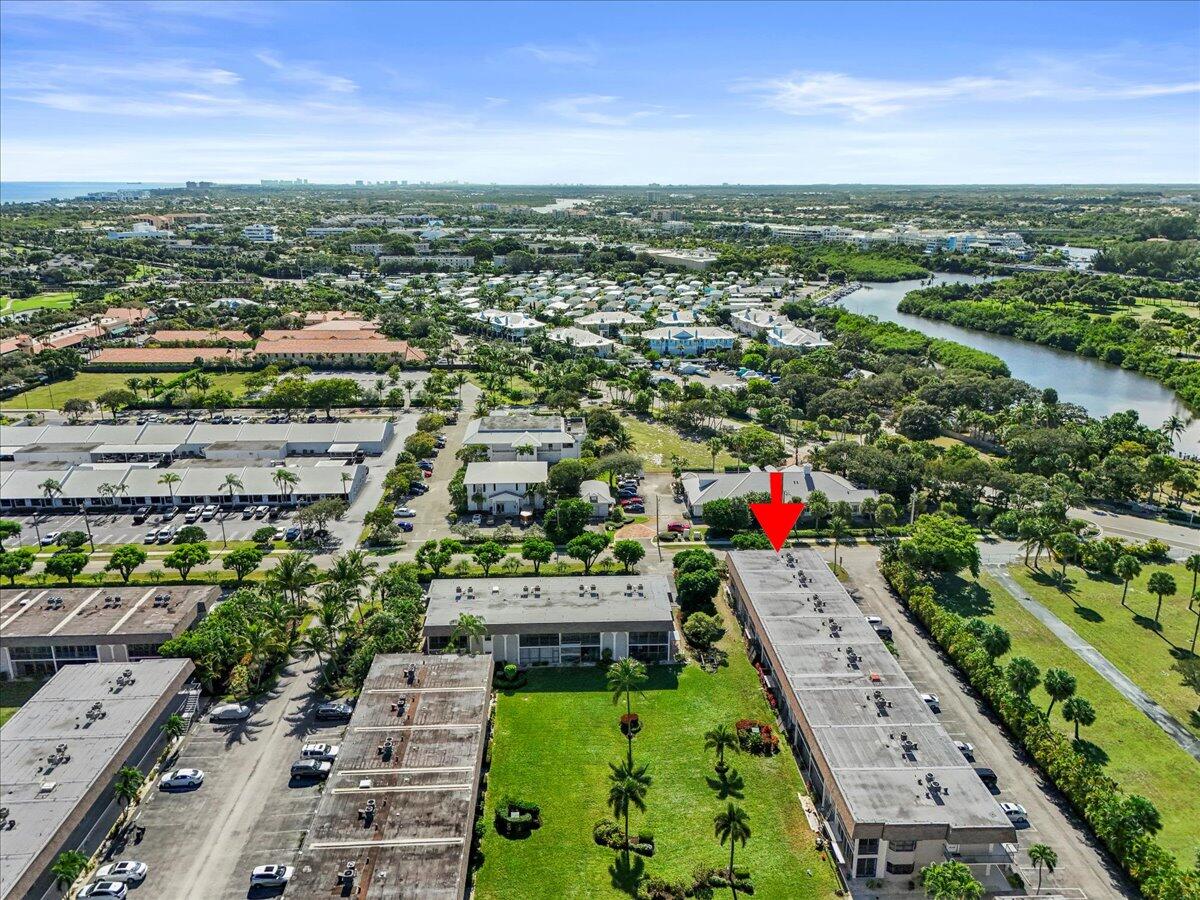 755 Saturn Street, Unit H101 Jupiter, FL 33477 - Photo 13 of 16 an aerial view of a city