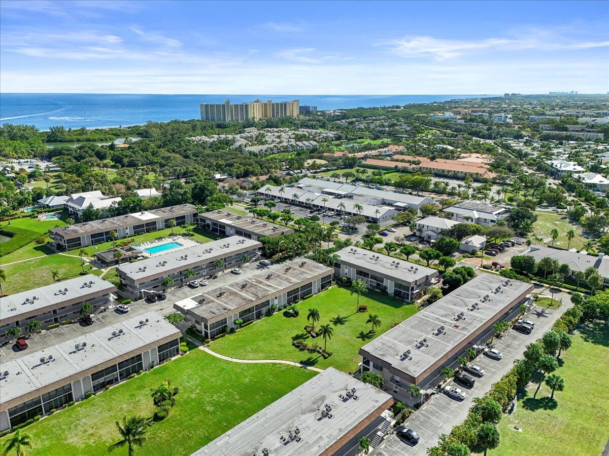 755 Saturn Street, Unit H101 Jupiter, FL 33477 - Photo 14 of 16 an aerial view of a city with lots of residential buildings