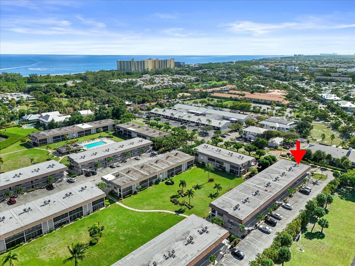 755 Saturn Street, Unit H101 Jupiter, FL 33477 - Photo 15 of 16 an aerial view of a city with lots of residential buildings