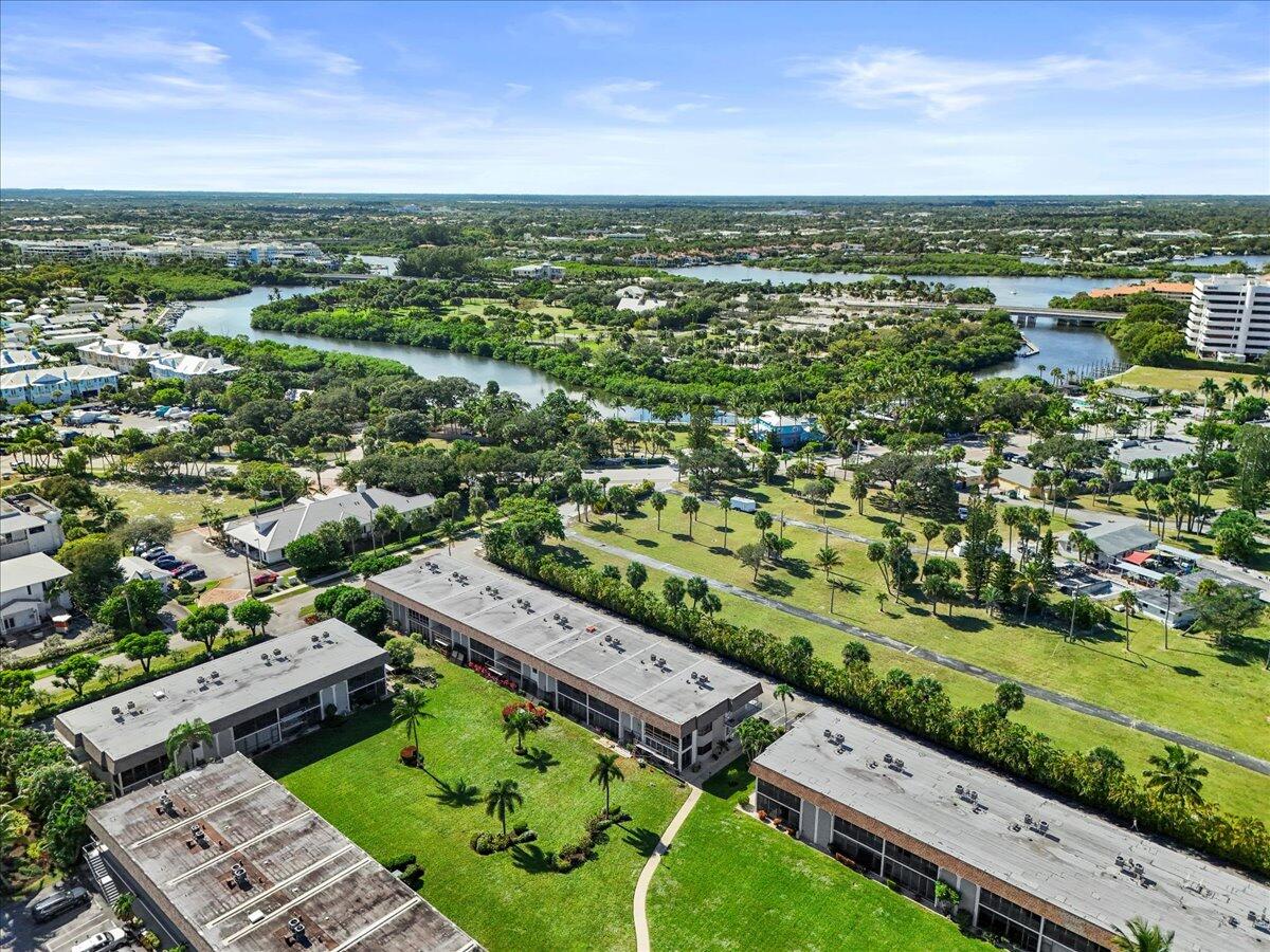 755 Saturn Street, Unit H101 Jupiter, FL 33477 - Photo 10 of 16 an aerial view of a city with lots of residential buildings