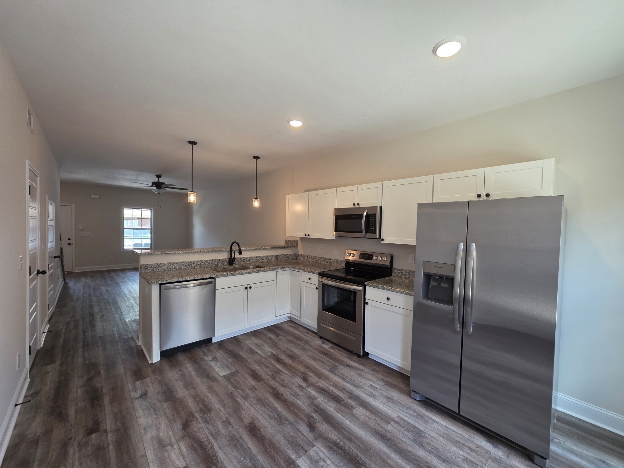 550 Peachers Mill Road, Unit E2 Clarksville, TN 37042 - Photo 2 of 11 a kitchen with stainless steel appliances a refrigerator sink and stove