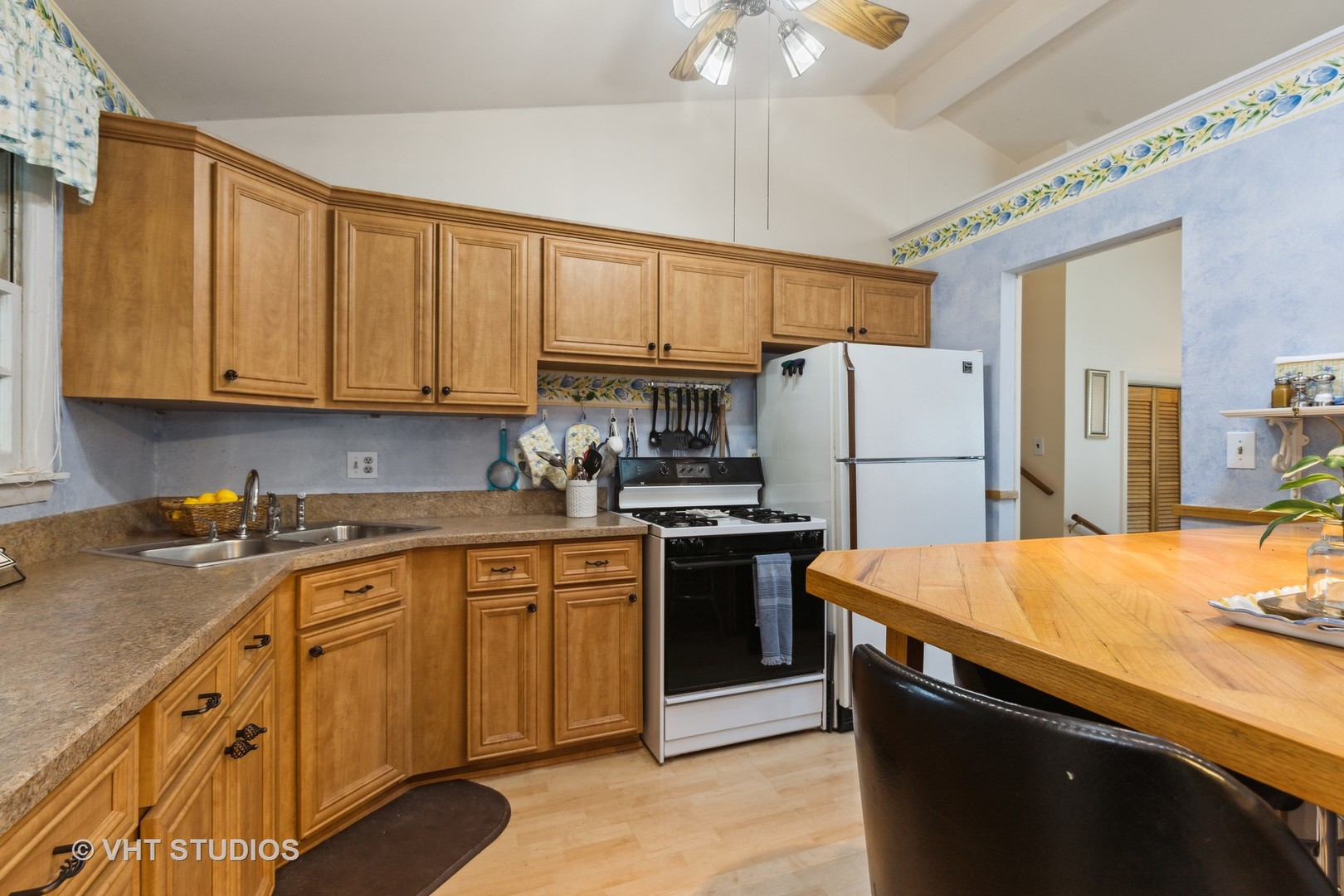 2107 Meadow Drive Lindenhurst, IL 60046 - Photo 4 of 18 a kitchen with stainless steel appliances granite countertop a sink stove and refrigerator