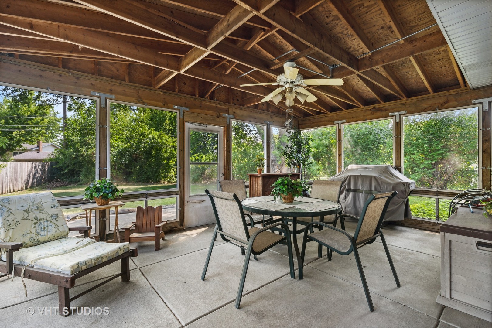 2107 Meadow Drive Lindenhurst, IL 60046 - Photo 7 of 18 a view of a patio with table and chairs and a big yard