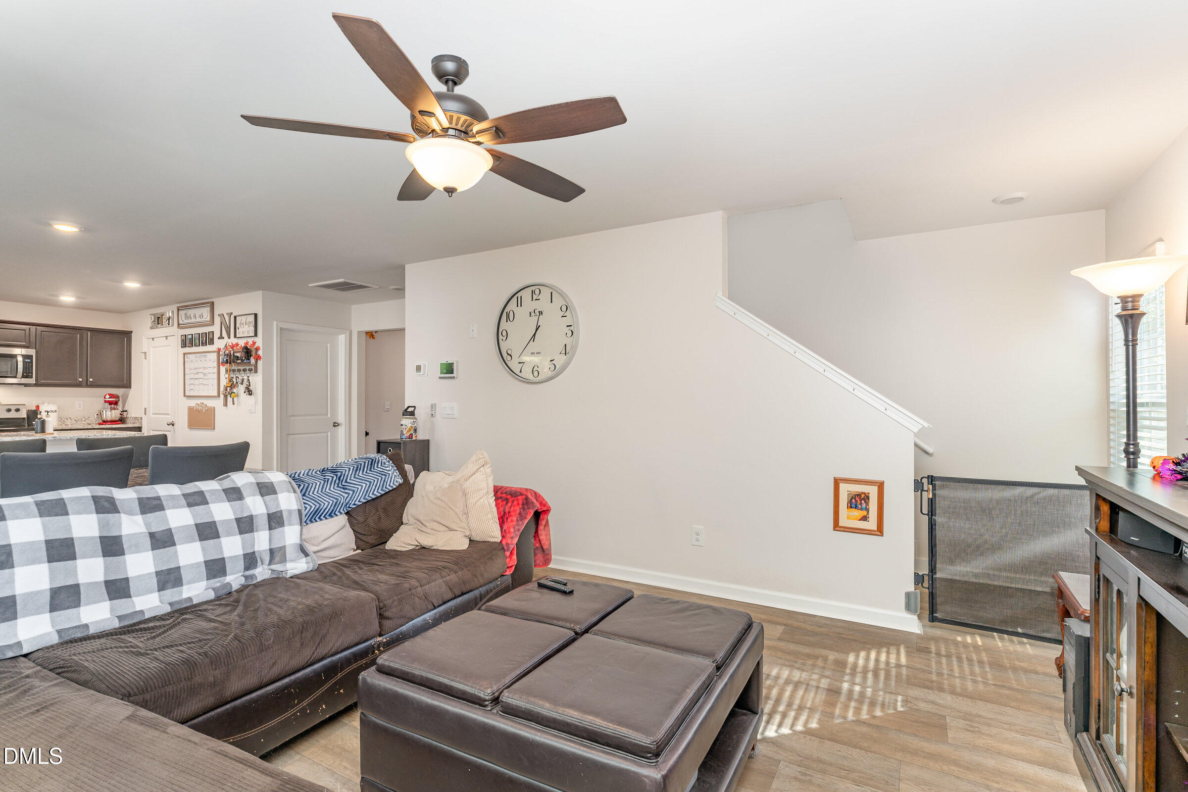 5496 Carolines Way Wilson, NC 27893 - Photo 11 of 71 a living room with furniture and a clock