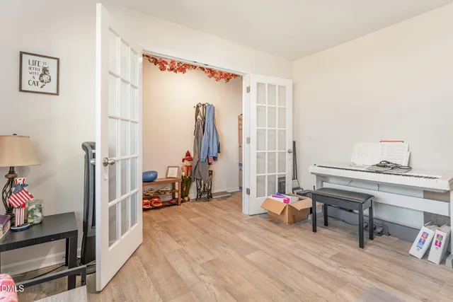 a bedroom with furniture and a gym equipment