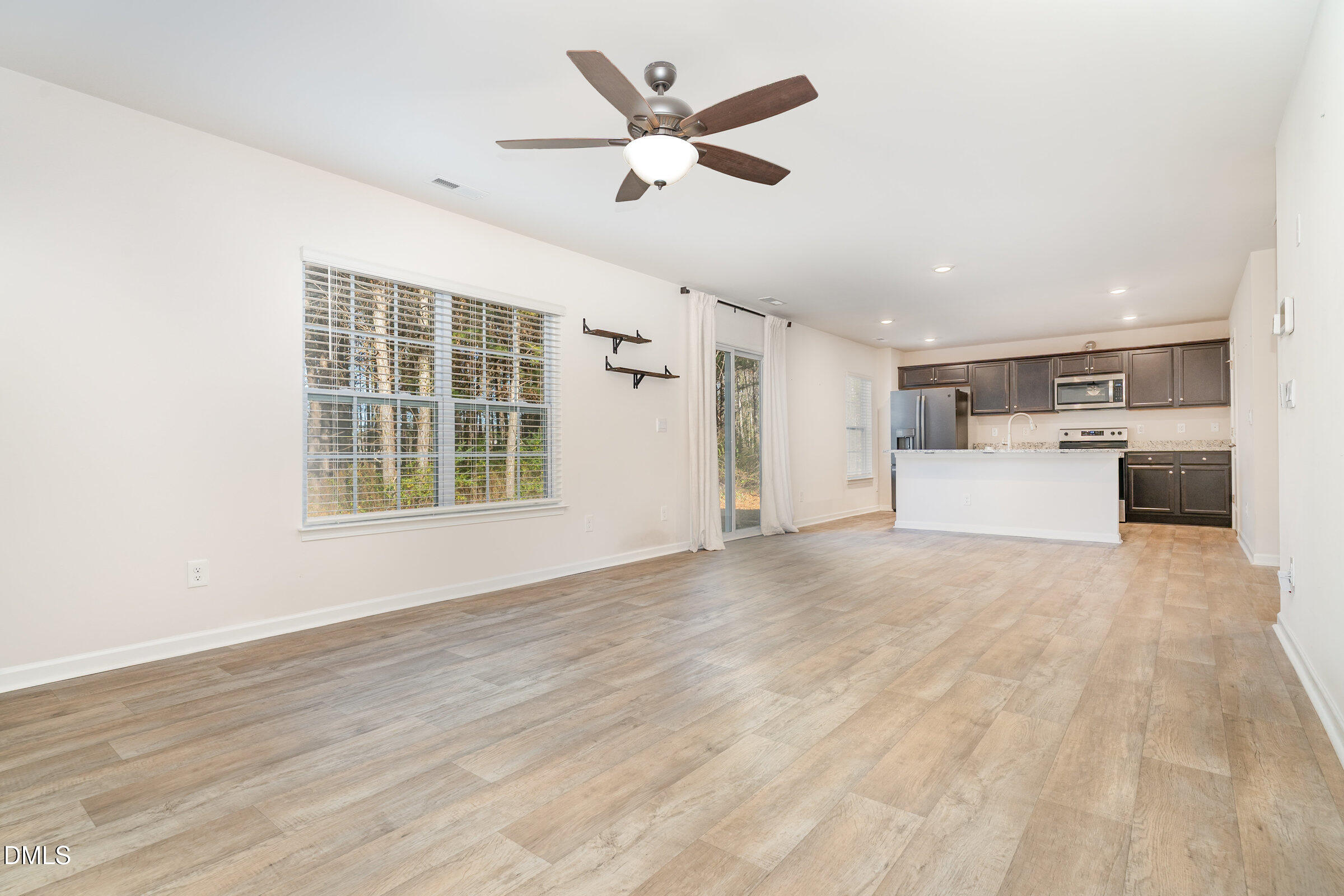 5496 Carolines Way Wilson, NC 27893 - Photo 15 of 71 a view of a kitchen with a sink and a ceiling fan