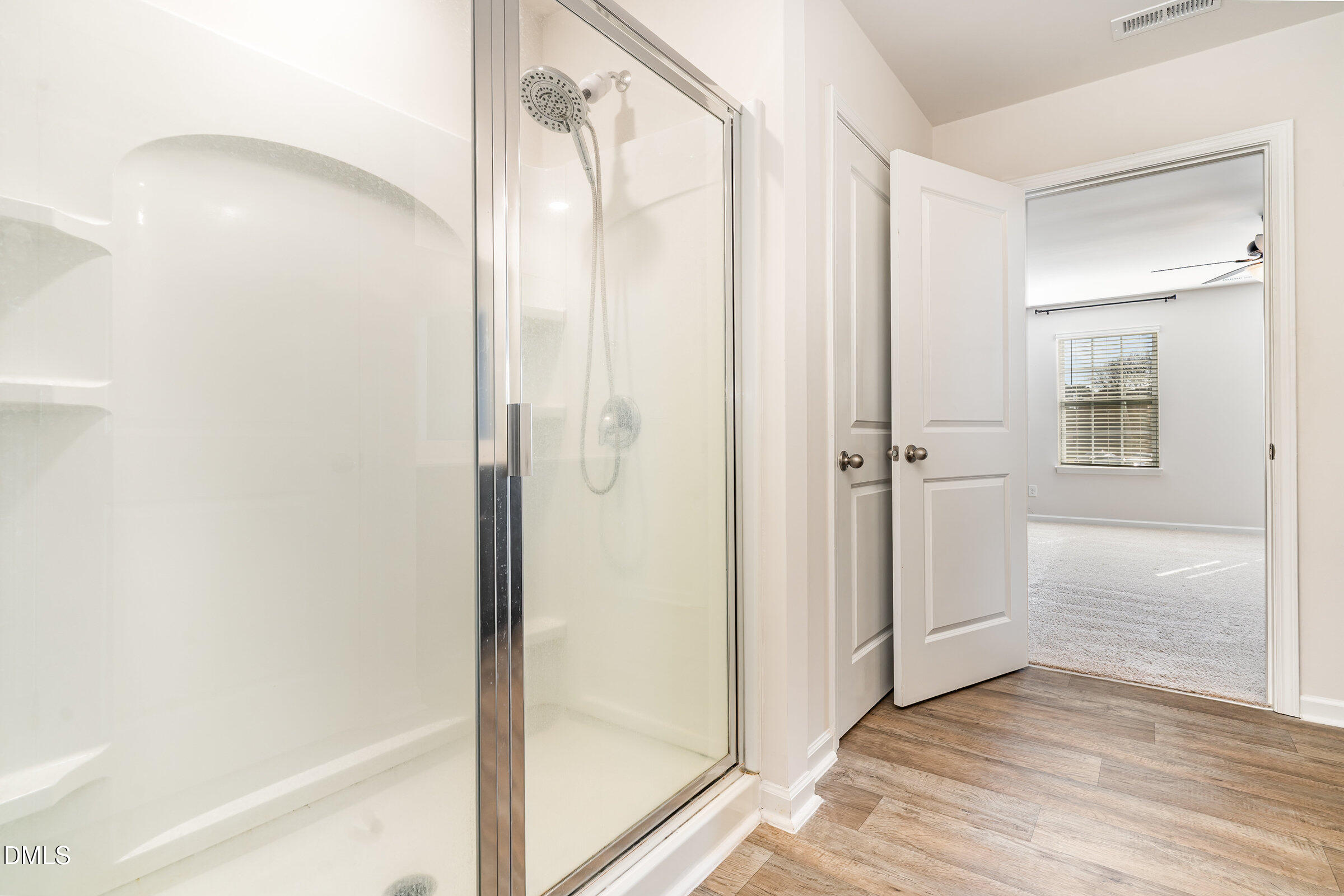 5496 Carolines Way Wilson, NC 27893 - Photo 24 of 71 a bathroom with a glass shower door