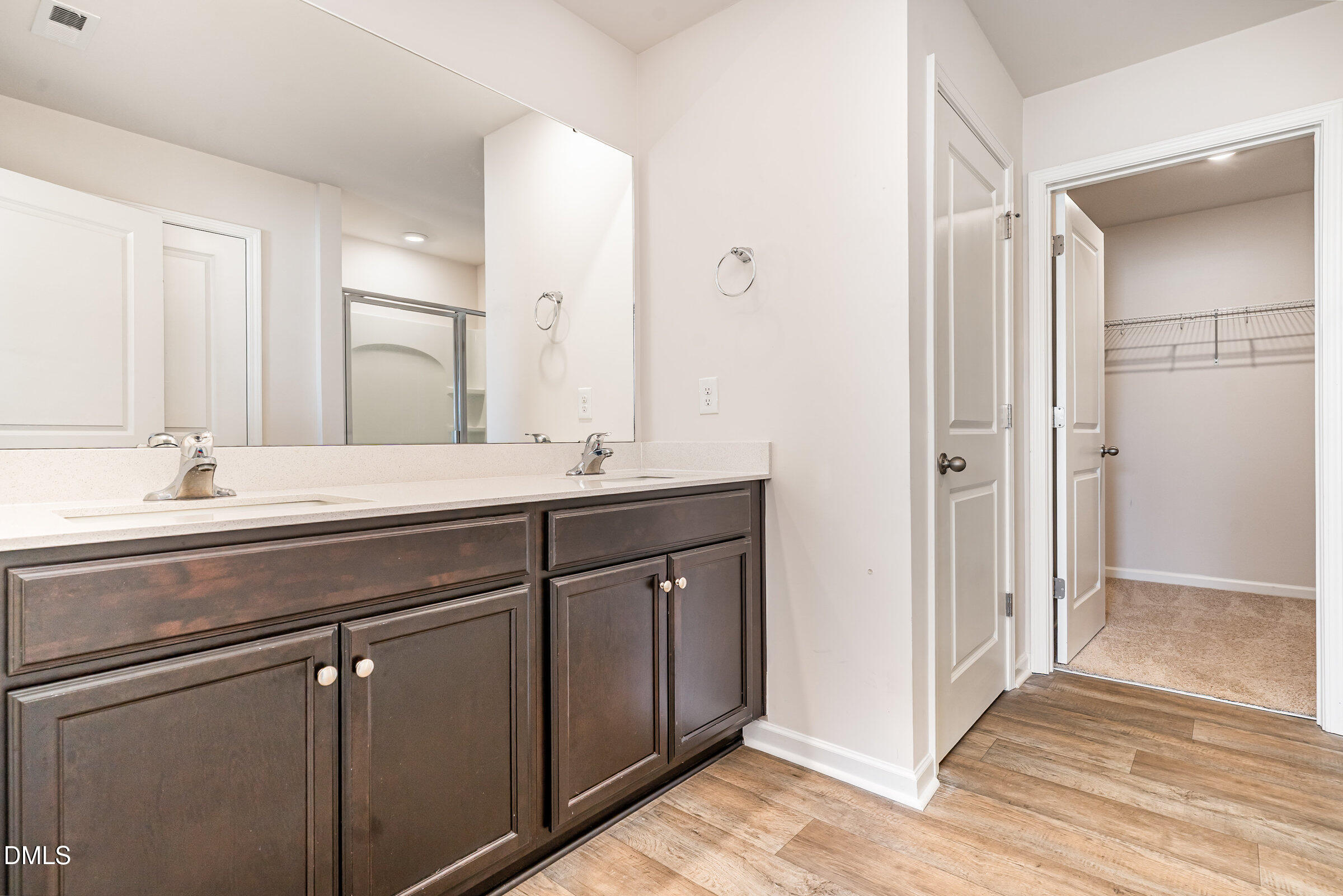 5496 Carolines Way Wilson, NC 27893 - Photo 26 of 71 a bathroom with a double vanity sink and mirror