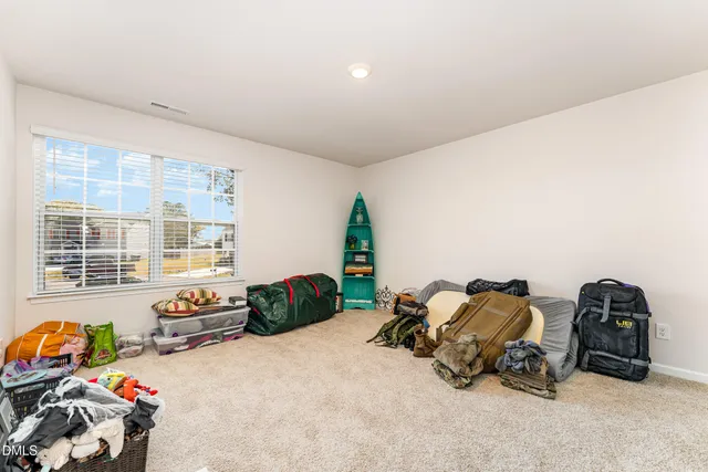 a bedroom with bed and a window