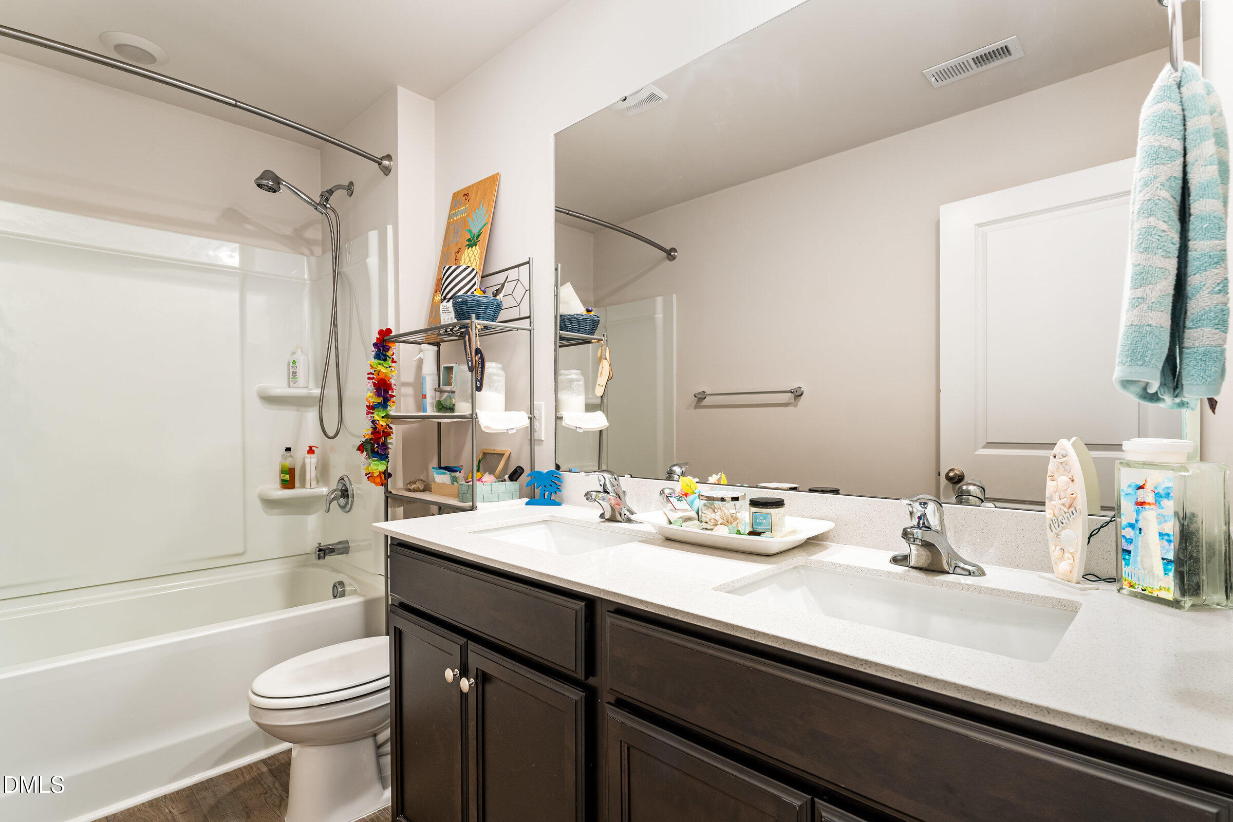 5496 Carolines Way Wilson, NC 27893 - Photo 34 of 71 a bathroom with a sink a toilet a tub and shower