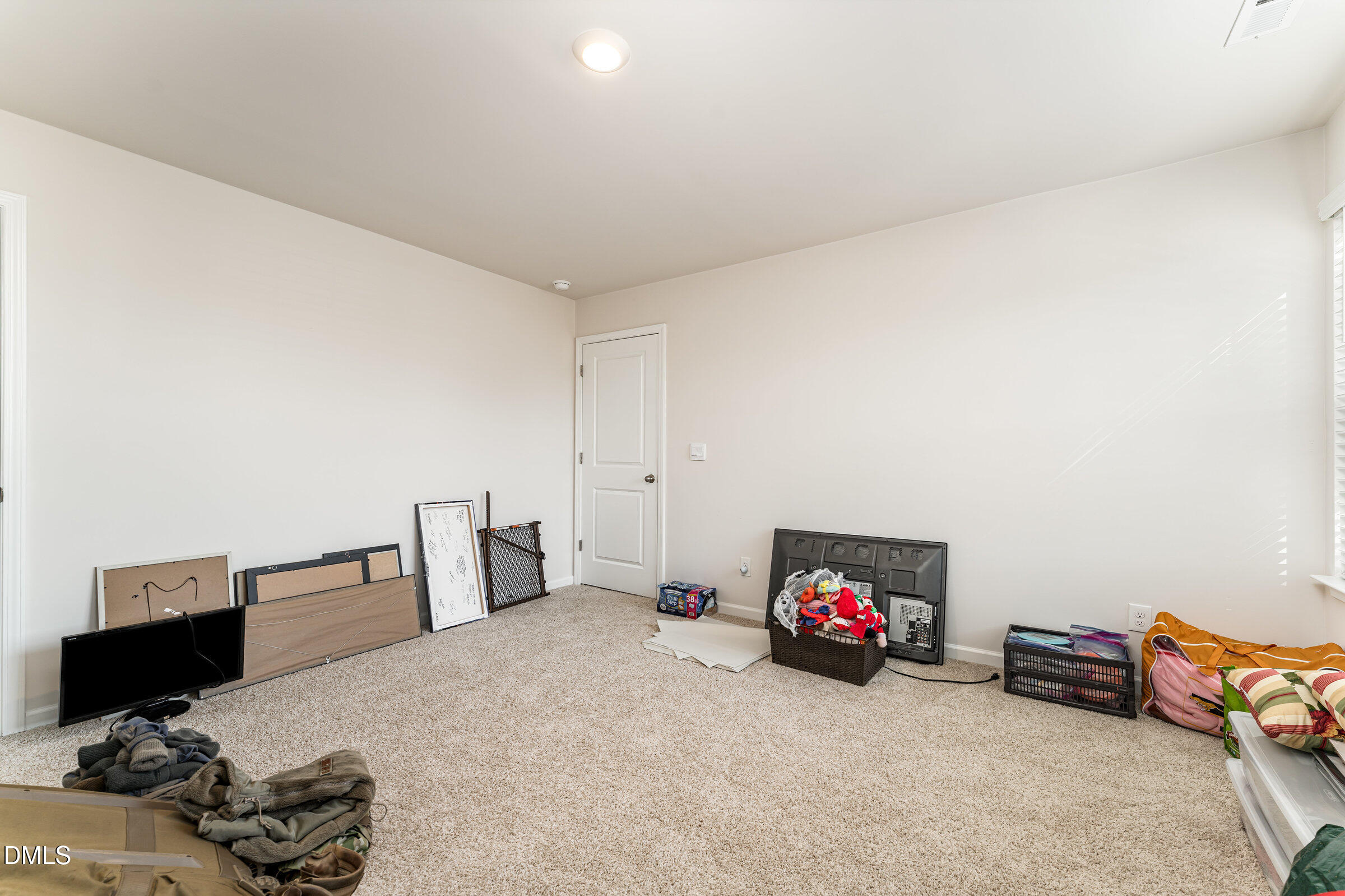 5496 Carolines Way Wilson, NC 27893 - Photo 37 of 71 a living room with furniture and a flat screen tv