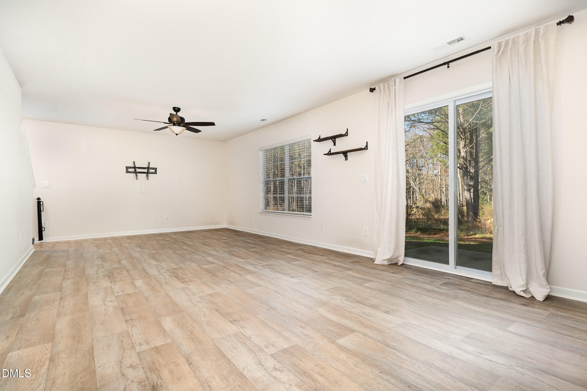 5496 Carolines Way Wilson, NC 27893 - Photo 3 of 71 a view of an empty room with a window