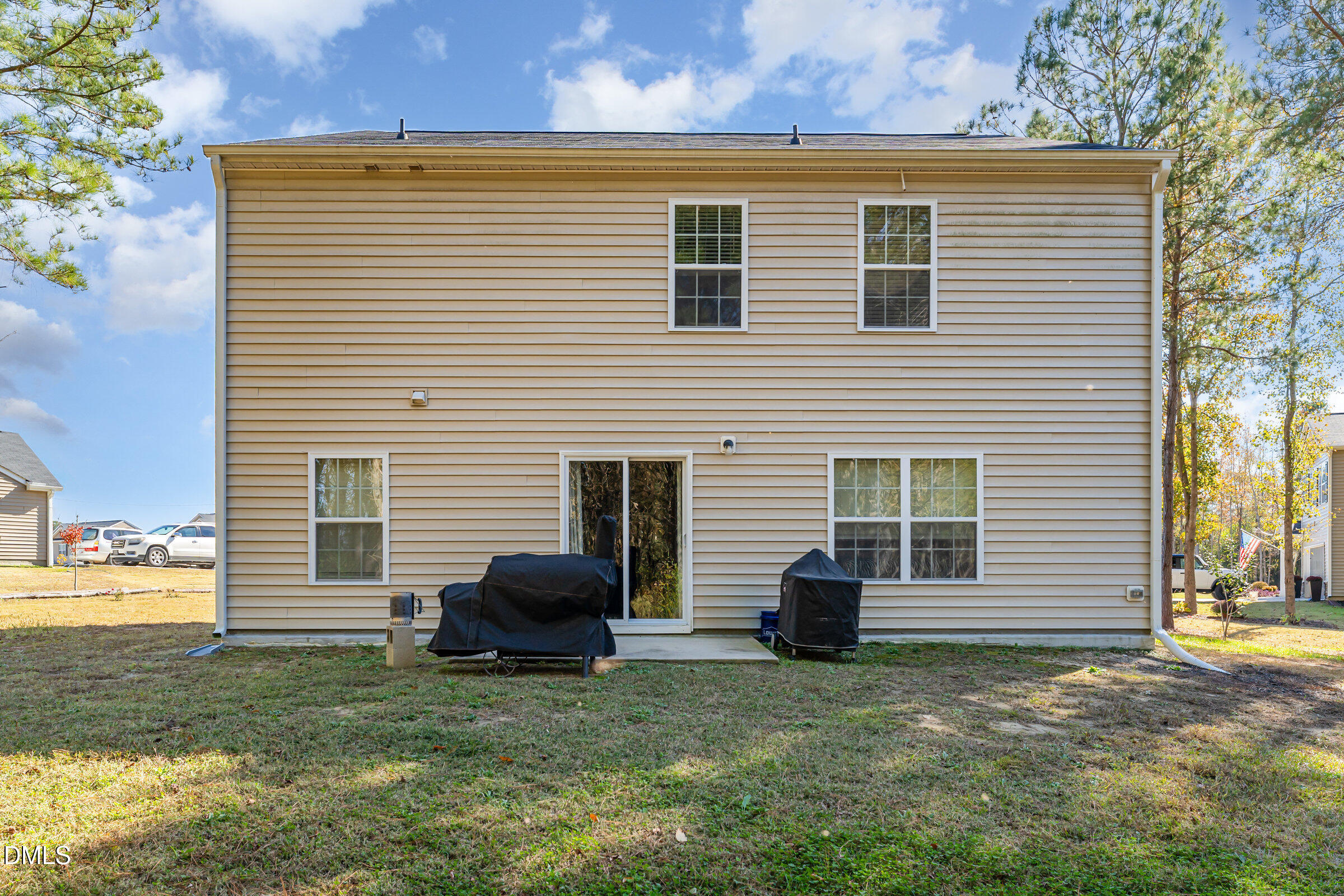 5496 Carolines Way Wilson, NC 27893 - Photo 40 of 71 a view of backyard of house and car parked