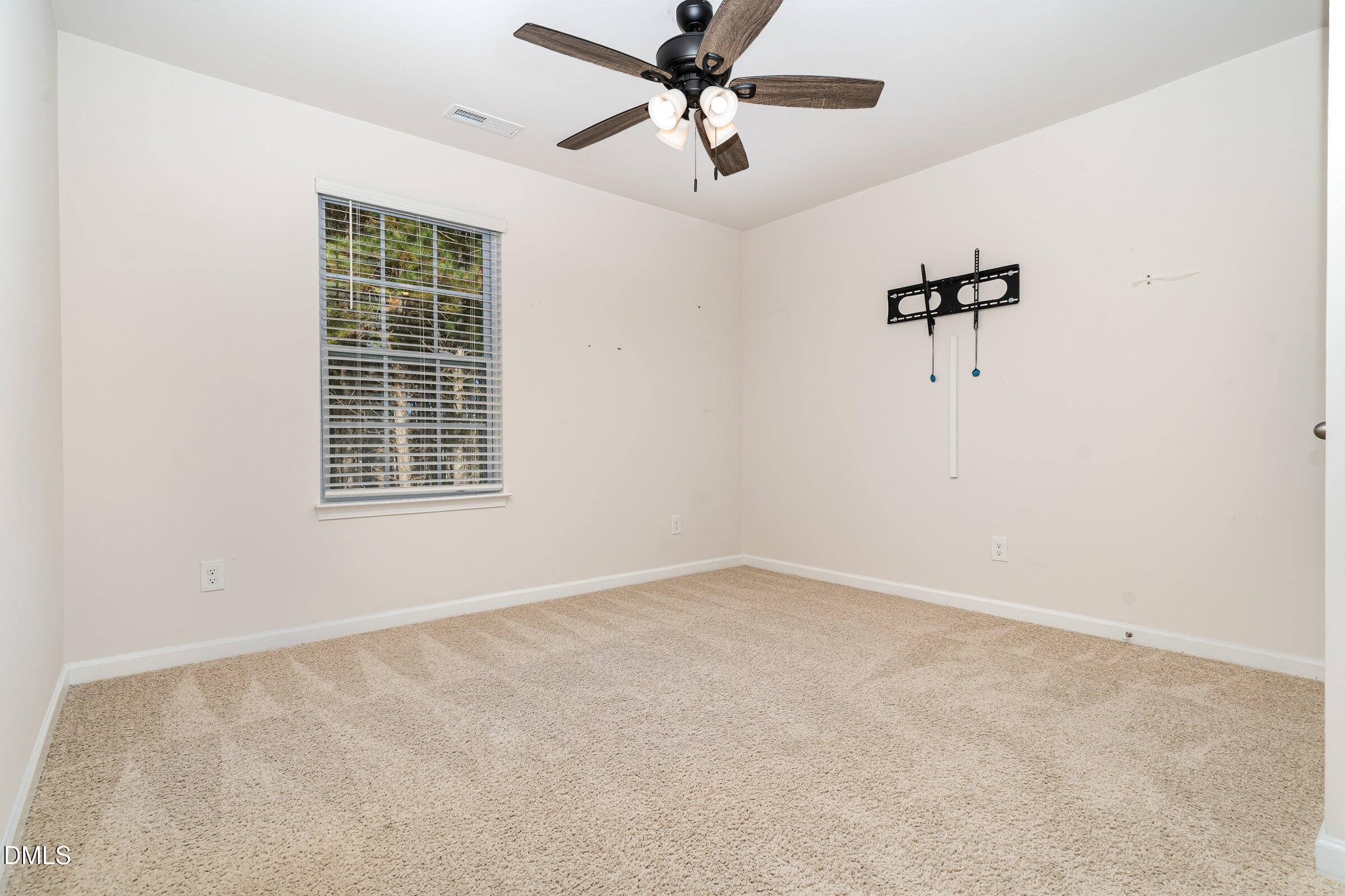 5496 Carolines Way Wilson, NC 27893 - Photo 55 of 71 an empty room with windows and fan
