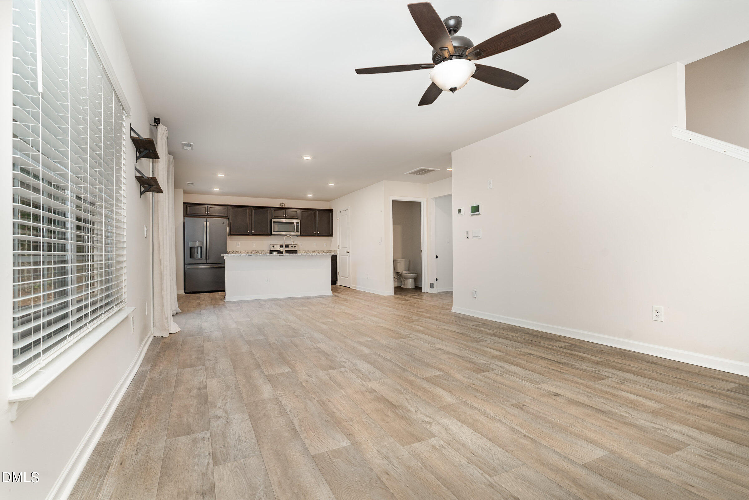 5496 Carolines Way Wilson, NC 27893 - Photo 9 of 71 a view of a kitchen with a sink and a refrigerator