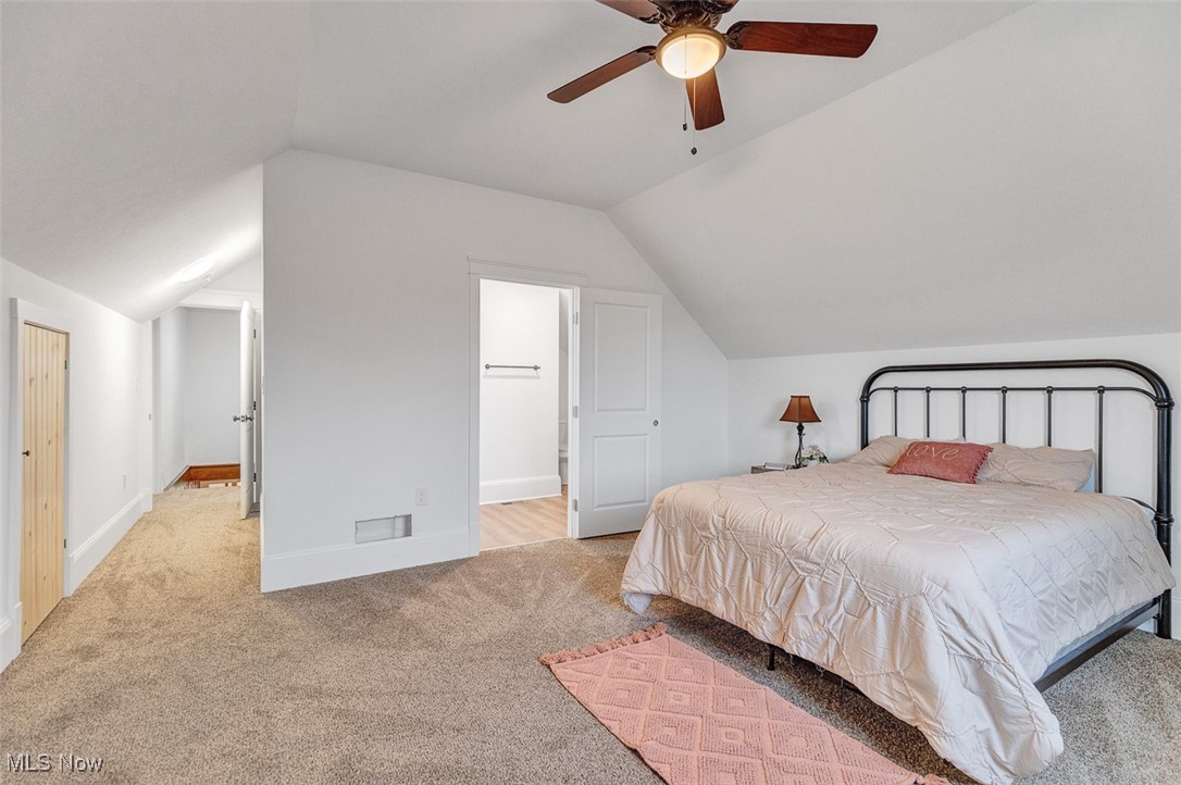 6517 Chippewa Road Medina, OH 44256 - Photo 30 of 45 Carpeted bedroom featuring lofted ceiling, ensuite bath, and ceiling fan