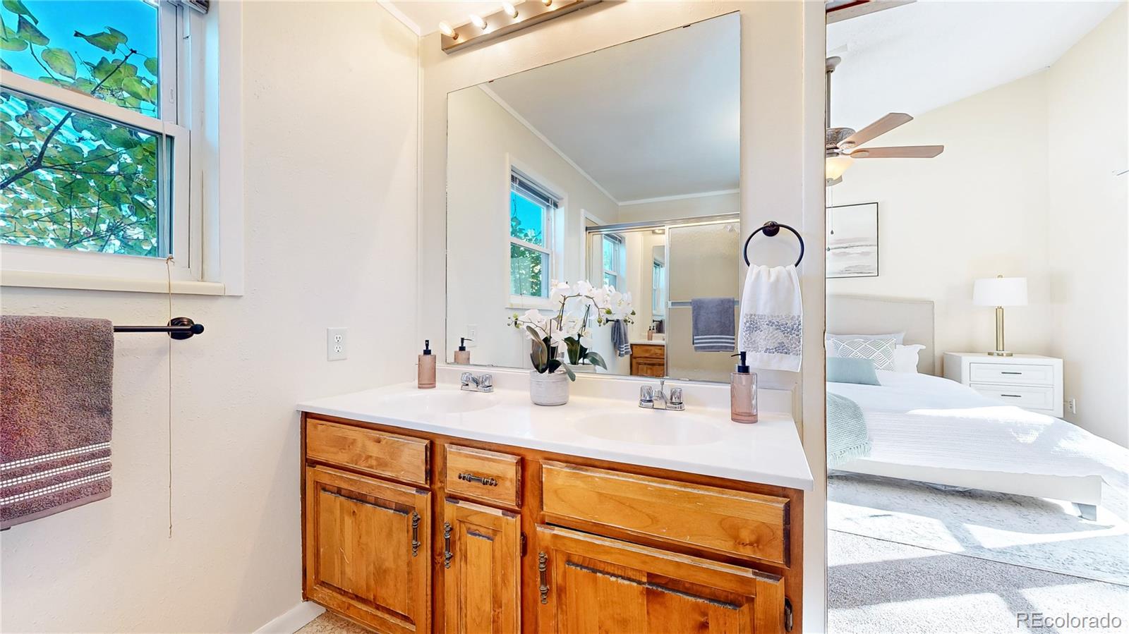 214 Poppy Street Golden, CO 80401 - Photo 14 of 31 a bath room with a sink and a mirror