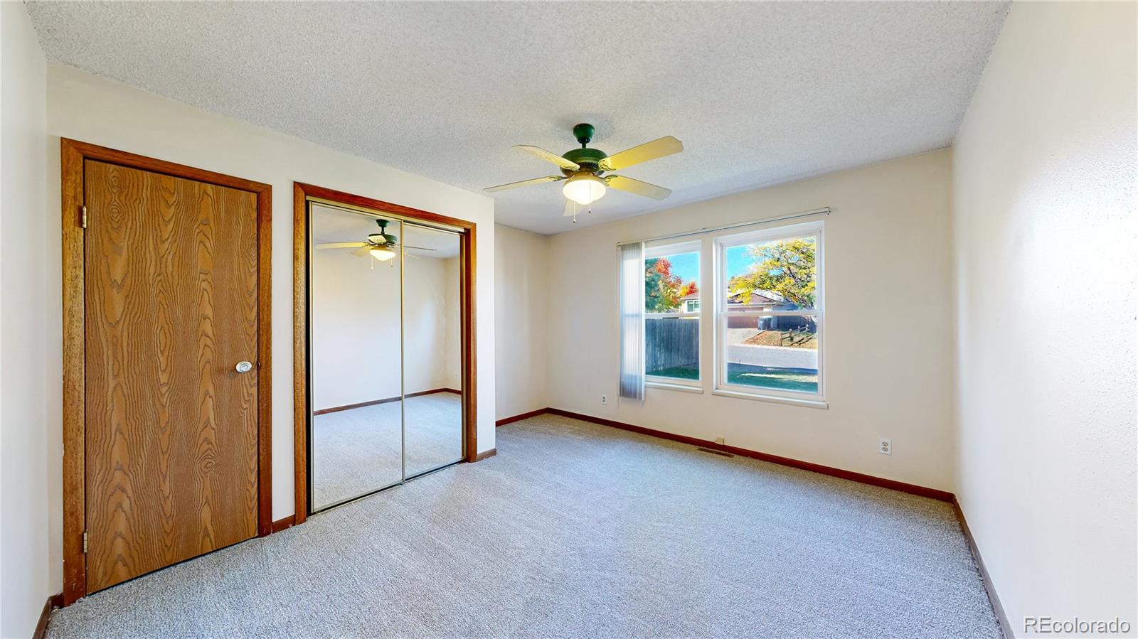 214 Poppy Street Golden, CO 80401 - Photo 15 of 31 an empty room with windows and fan