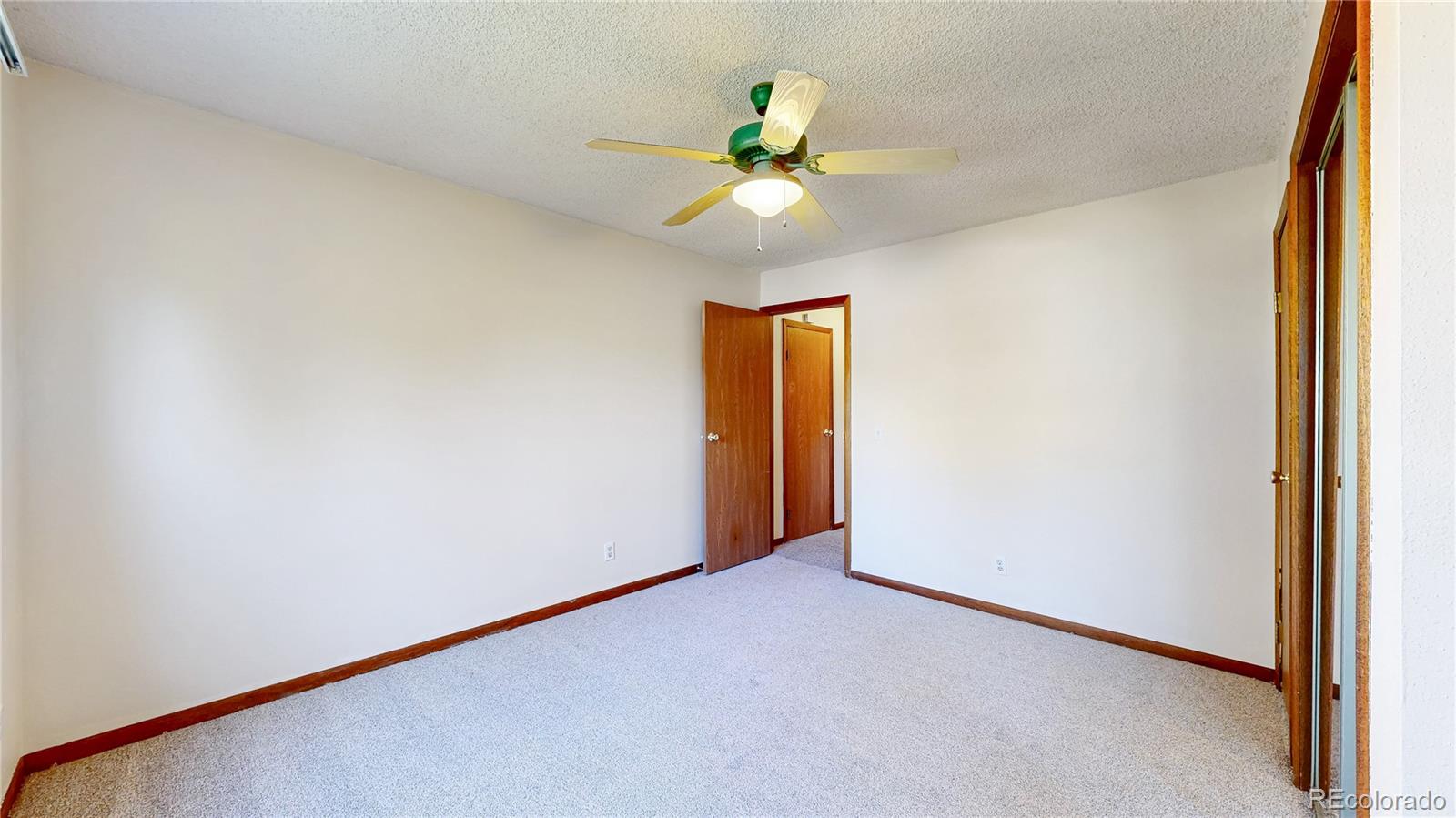 214 Poppy Street Golden, CO 80401 - Photo 16 of 31 an empty room with a window and a fan