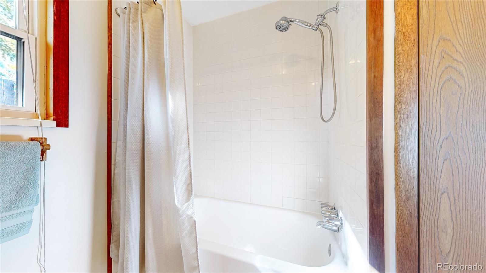 214 Poppy Street Golden, CO 80401 - Photo 18 of 31 a bathroom with a bathtub and a shower