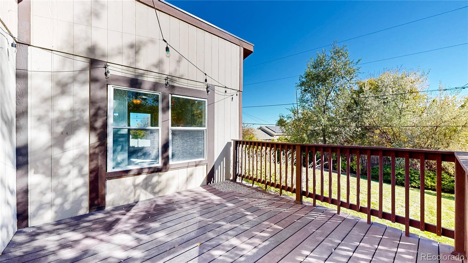 214 Poppy Street Golden, CO 80401 - Photo 20 of 31 a view of a balcony with wooden floor and fence