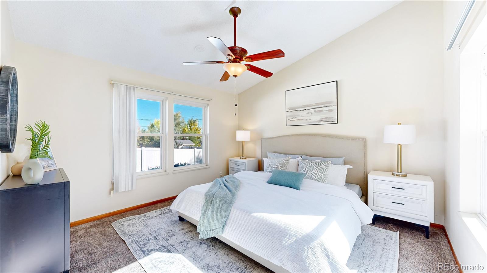 214 Poppy Street Golden, CO 80401 - Photo 3 of 31 a bedroom with a bed and a window