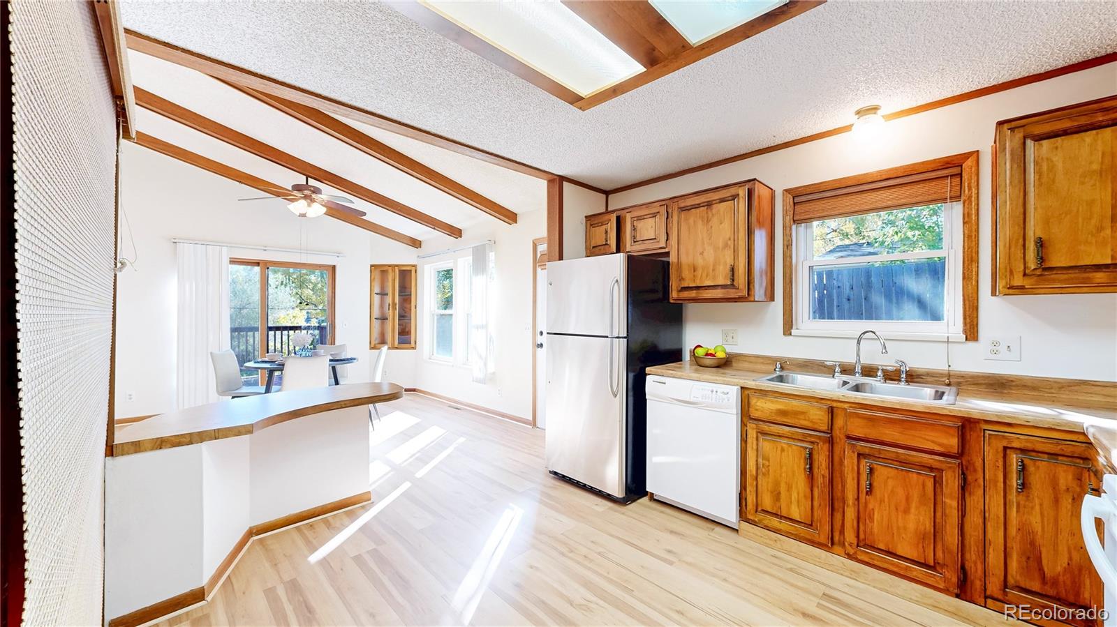 214 Poppy Street Golden, CO 80401 - Photo 4 of 31 a kitchen with a refrigerator and a sink