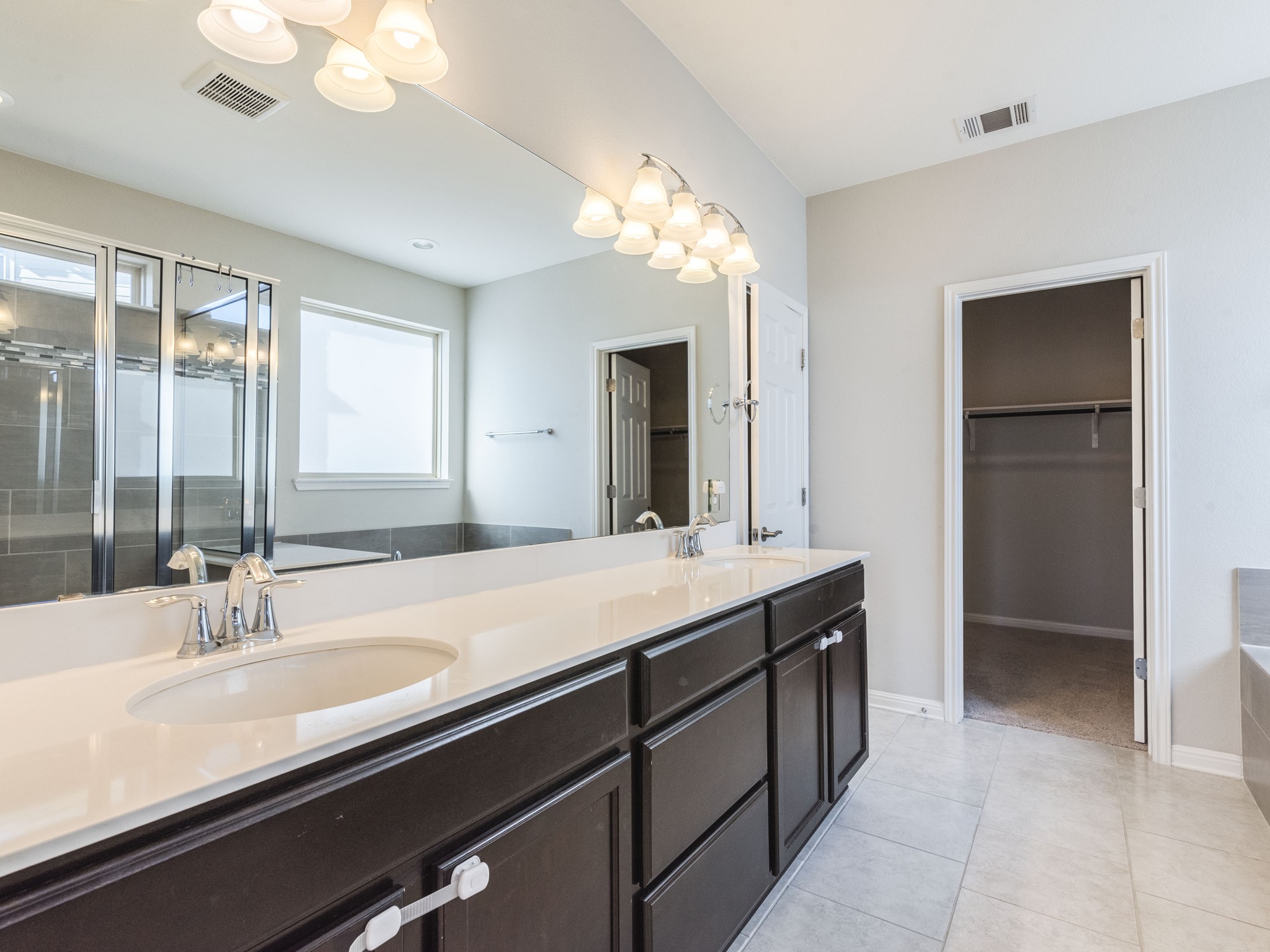 6829 Banff Cove Austin, TX 78754 - Photo 15 of 39 a bathroom with a sink and a mirror