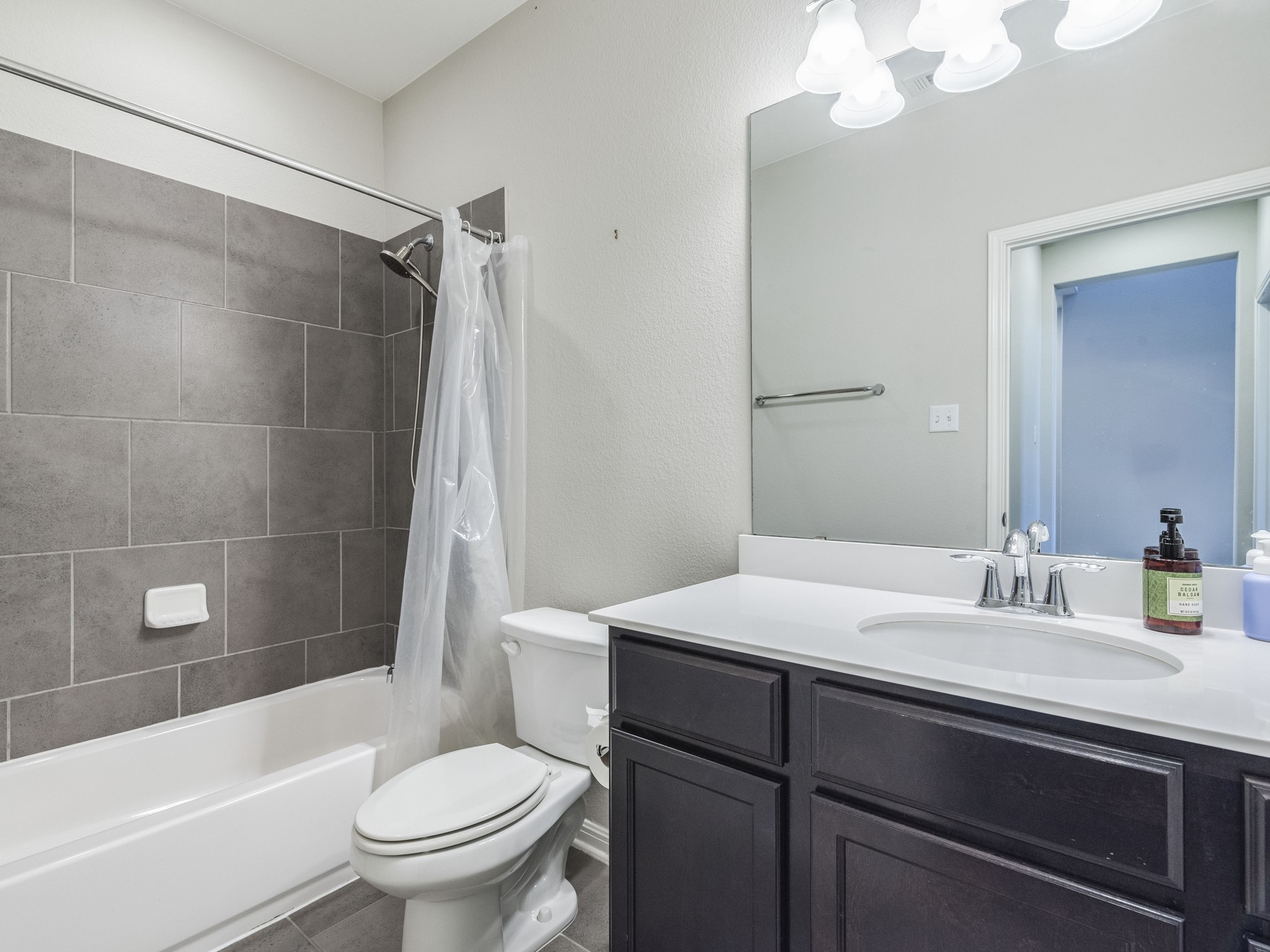 6829 Banff Cove Austin, TX 78754 - Photo 21 of 39 a bathroom with a sink a toilet and shower