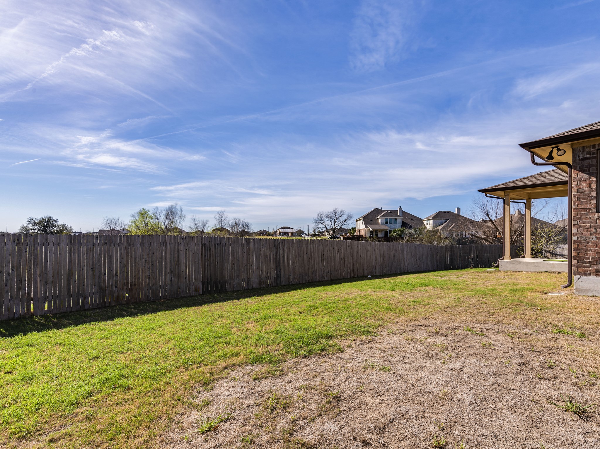 6829 Banff Cove Austin, TX 78754 - Photo 35 of 39 a view of an house with backyard and wooden fence