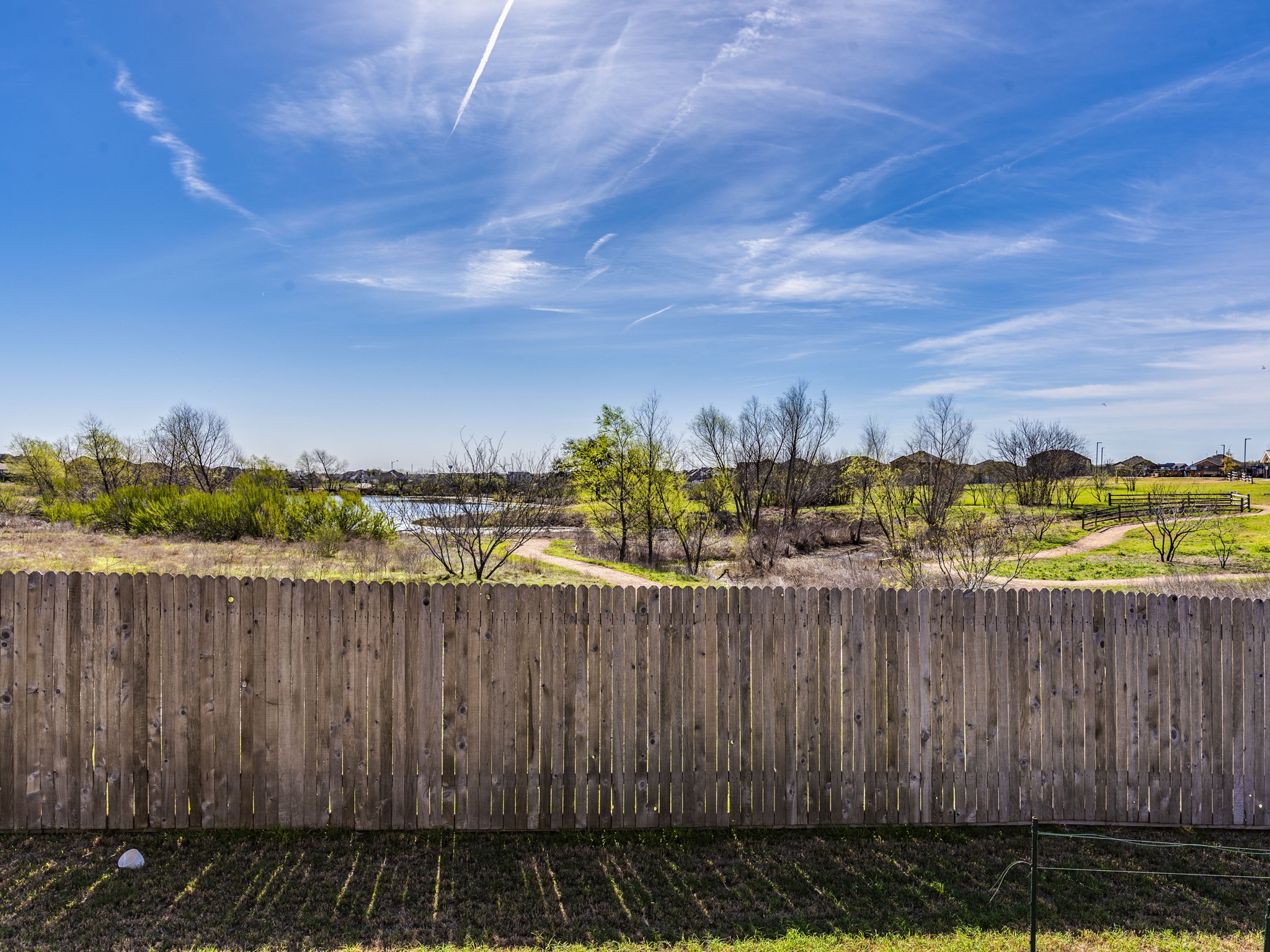 6829 Banff Cove Austin, TX 78754 - Photo 36 of 39 a view of a pathway with a wrought fence